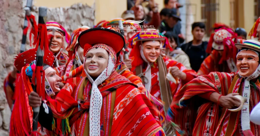 Festival dancers in Ollantaytambo wearing traditional masks and Andean textiles during Three Kings Day in Peru.