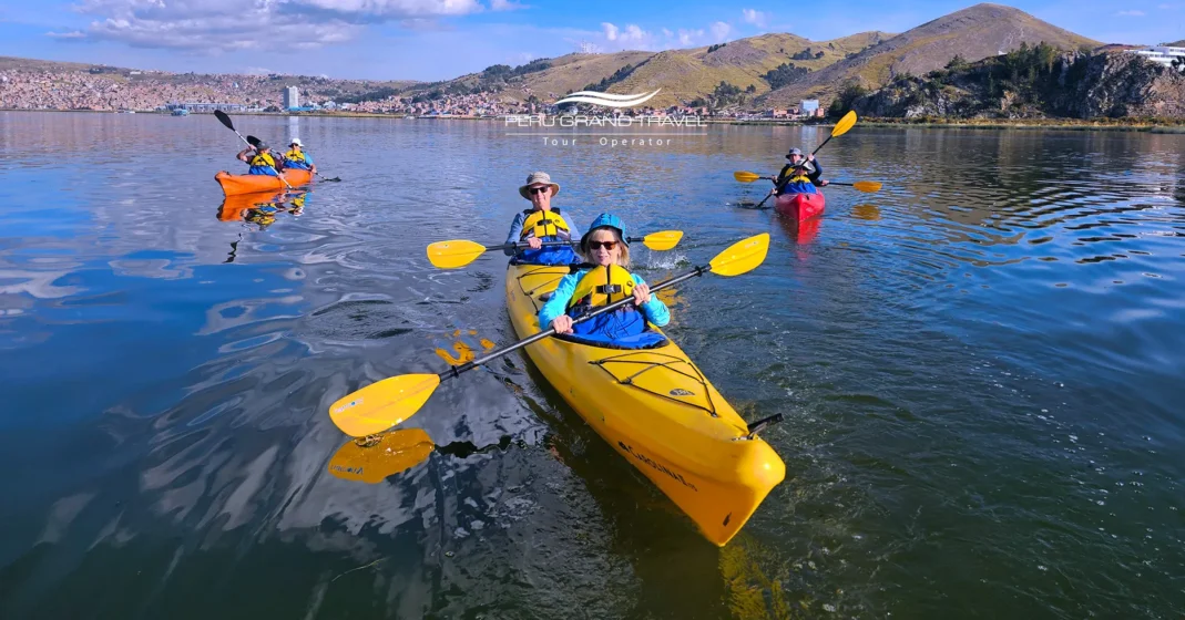 Traveler kayaking on Lake Titicaca with calm blue waters and Andean mountains in the background.