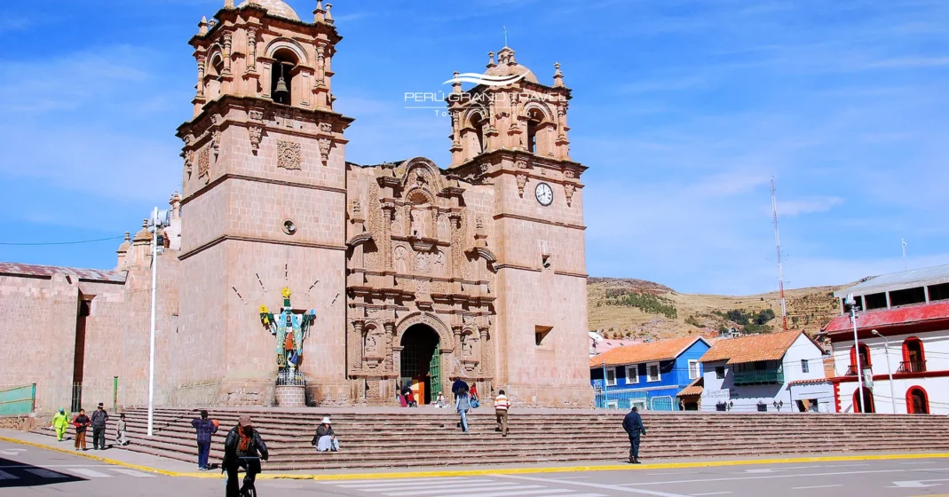 Main Square of Puno Cathedral Basilica with twin towers and stone baroque façade under a clear blue Andean sky