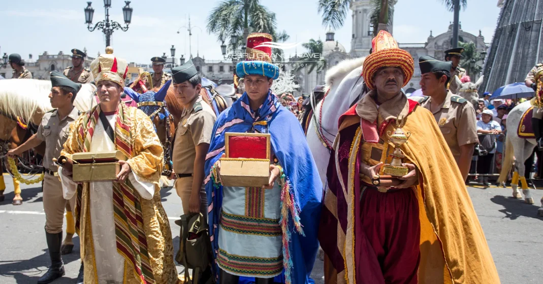 Three Kings Day celebration in Peru with actors dressed as the Magi carrying gifts during Bajada de Reyes.