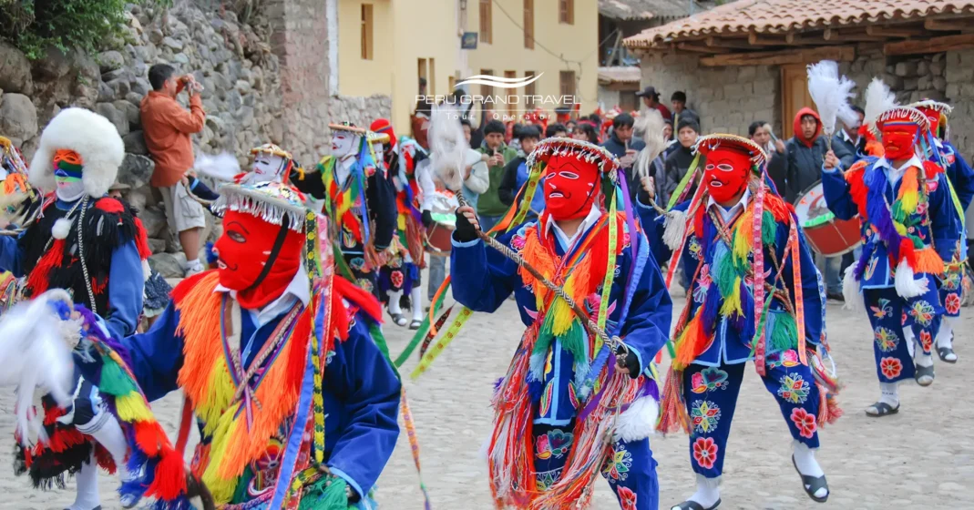 Traditional masked dancers in Ollantaytambo celebrating Bajada de Reyes in the Sacred Valley, Peru.