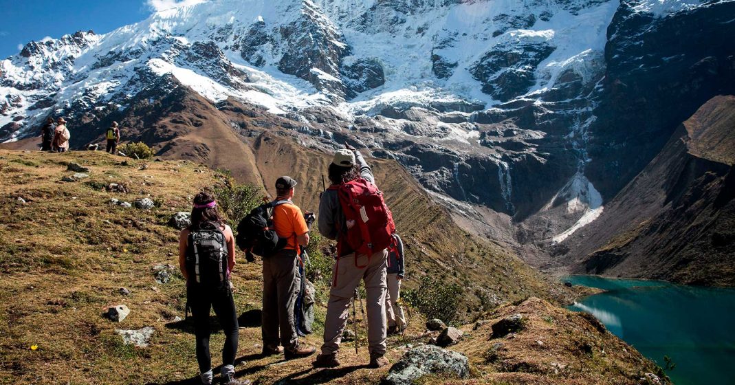 tourism in peru adventure in cusco, people in the humantay lagoon