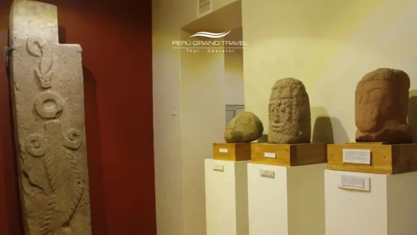 Stone sculptures and carved monoliths displayed inside the Carlos Dreyer Museum in Puno