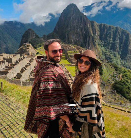 Tourists at Machu Picchu overlooking the Inca citadel