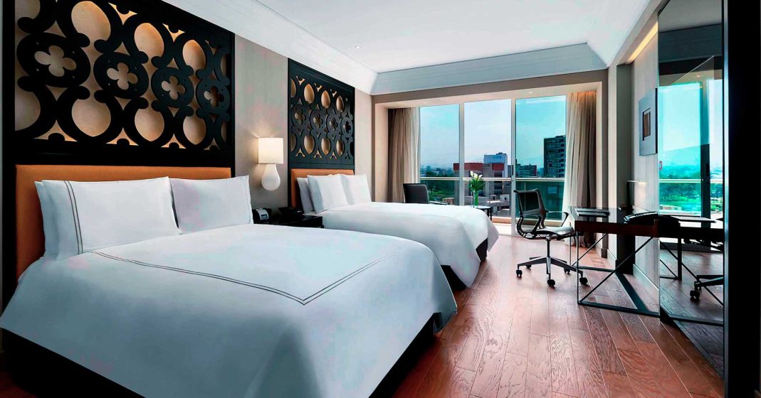 Luxury hotels in Lima, Peru - Hilton Miraflores: room view, beds, lighting, and windows