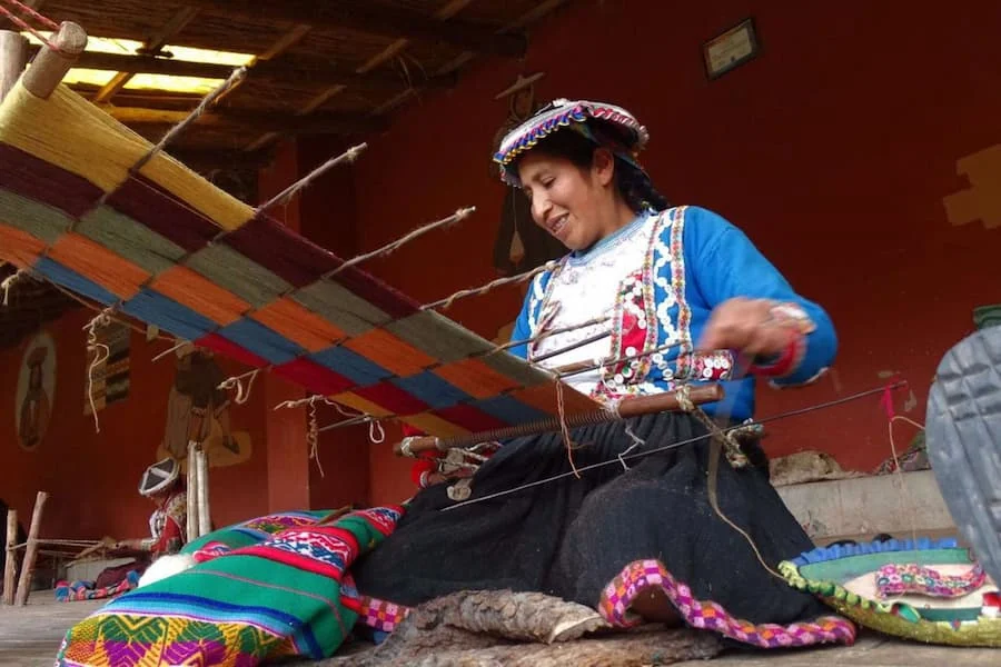Woman weaving poncho with inca technique